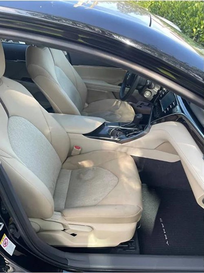 Before, a Camry cloth interior dulled by dust, stains and wear